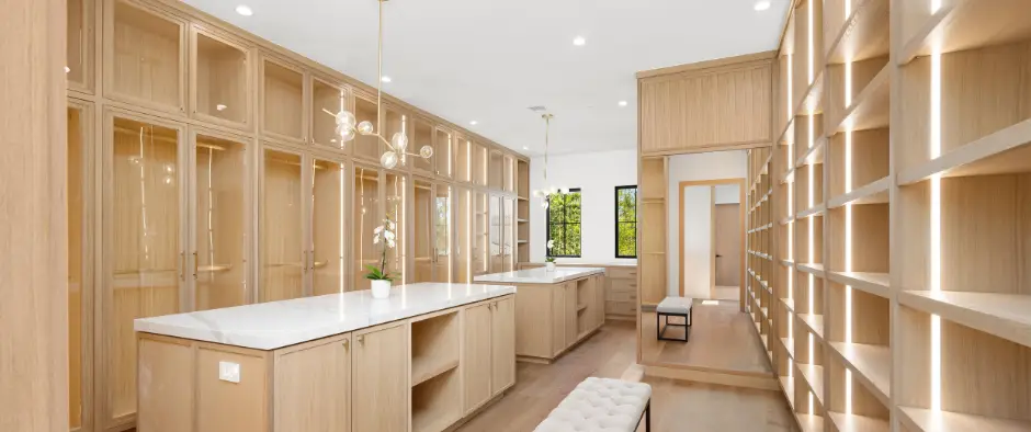 modern custom closet with white marble countertops